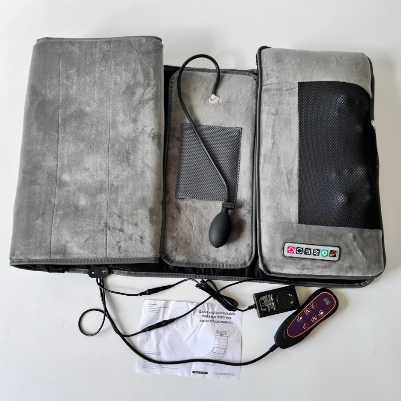 Hlpmedical full body heated massage mat with 10 vibrating motors for pain relief and relaxation on a mattress pillow in gray color.