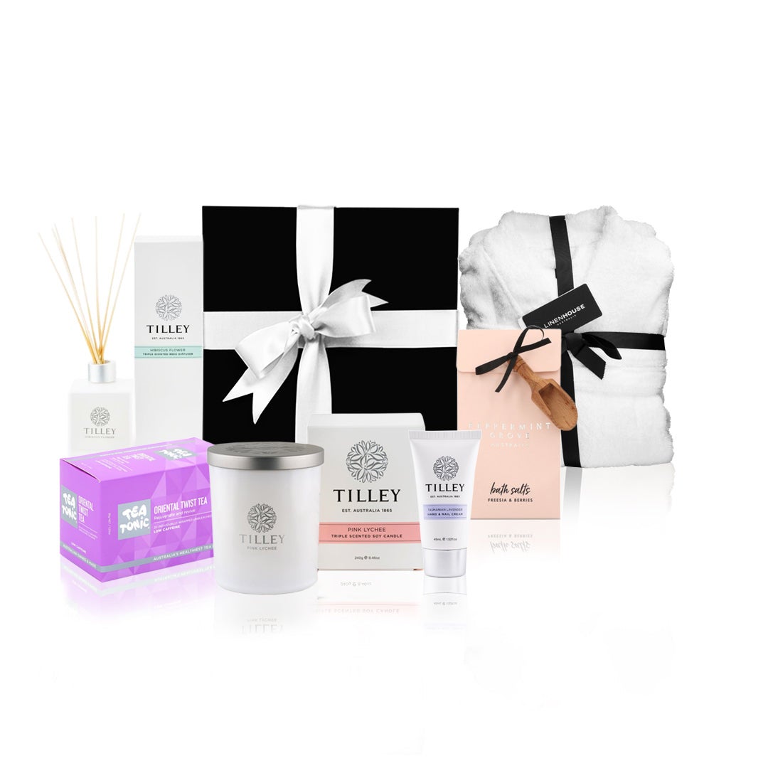 Luxury self-care gift hamper by Hlpmedical featuring skincare products, bath essentials, and wellness items arranged in a stylish basket.