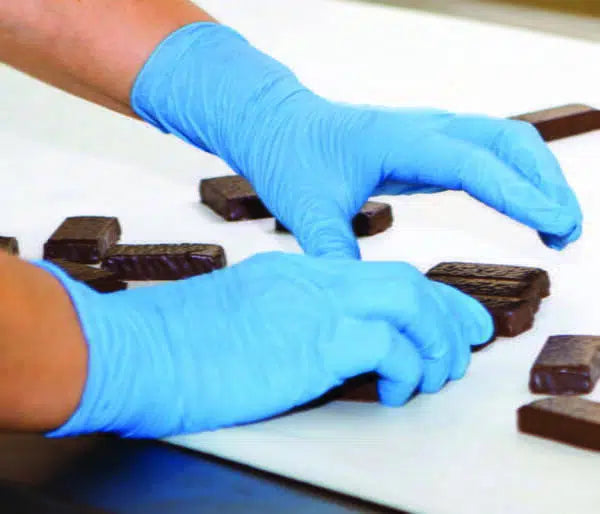 Blue and chocolate-colored Nitrile examination gloves by HLP Medical Supplies, powder-free, shown in a carton of 1000.