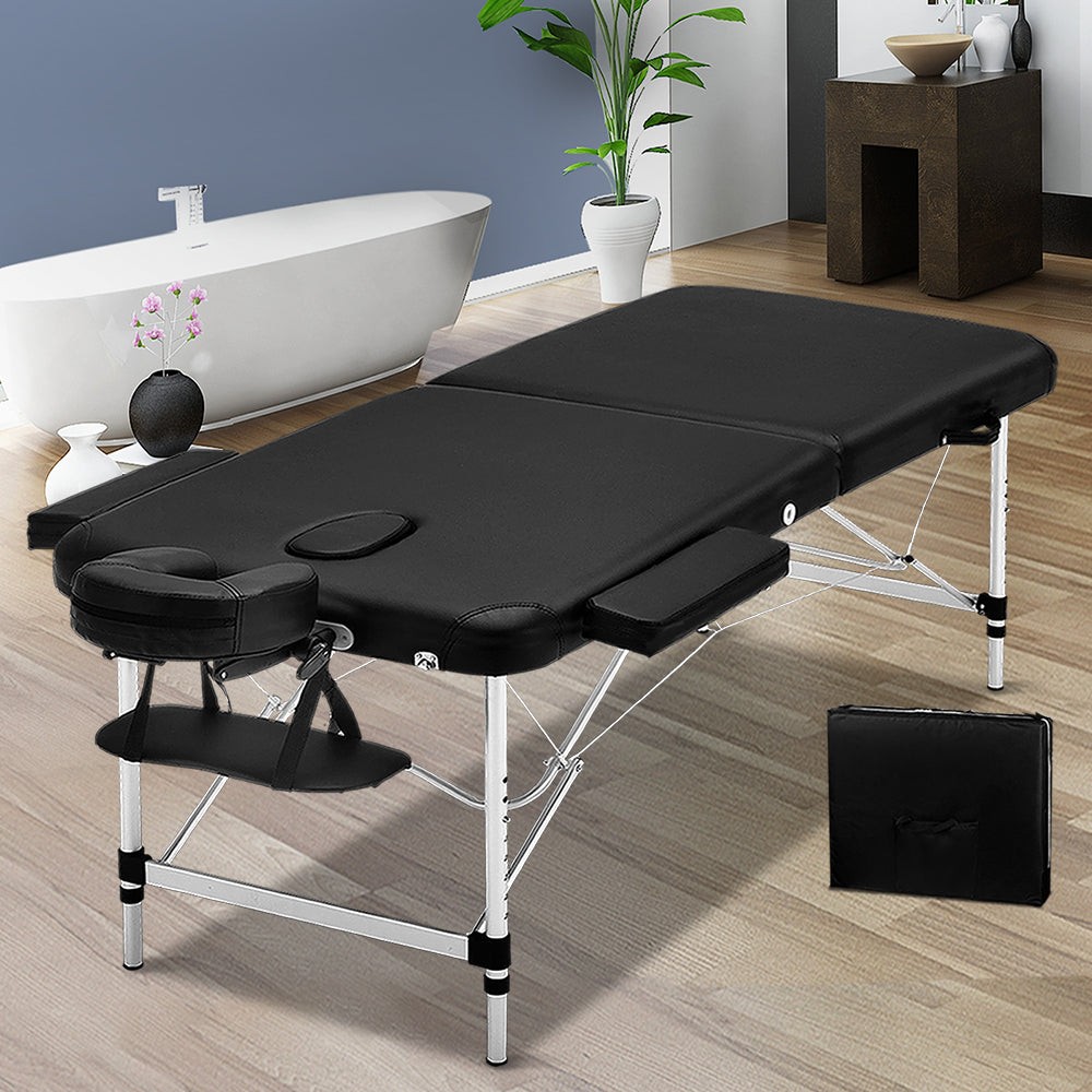 Black portable Zenses massage table by Hlpmedical, 75cm wide with aluminum frame, foldable for easy transport and relaxation.