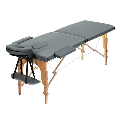 Portable Zenses massage table by Hlpmedical with 56cm width, two-fold wooden design, grey upholstery for professional relaxation treatments.