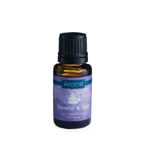 Hlpmedical Serene & Still essential oil blend in a glass bottle, ideal for massage and relaxation in health and beauty routines