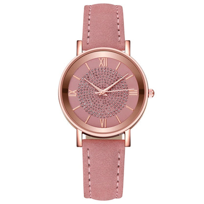 Rose gold women's fashion wristwatch with leather strap, quartz movement, stainless steel dial, Roman numerals, and minimalist design.