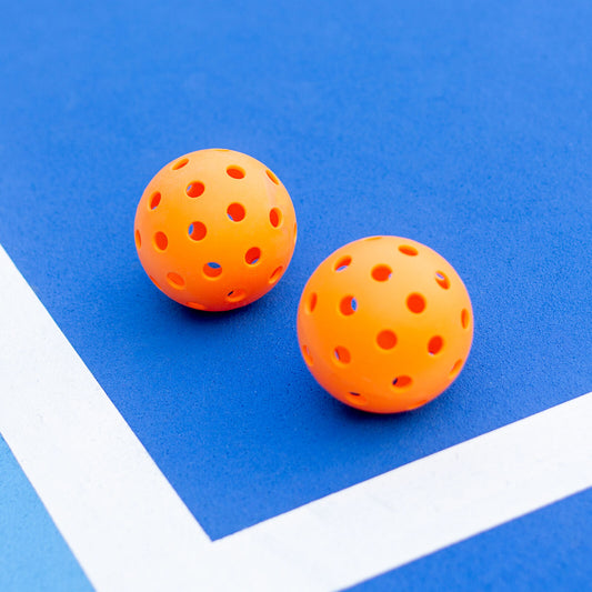 Six Hlpmedical Precision Aerodynamic 40 Hole Design Pickleball Balls in a pack, designed for optimal performance in racquet sports.