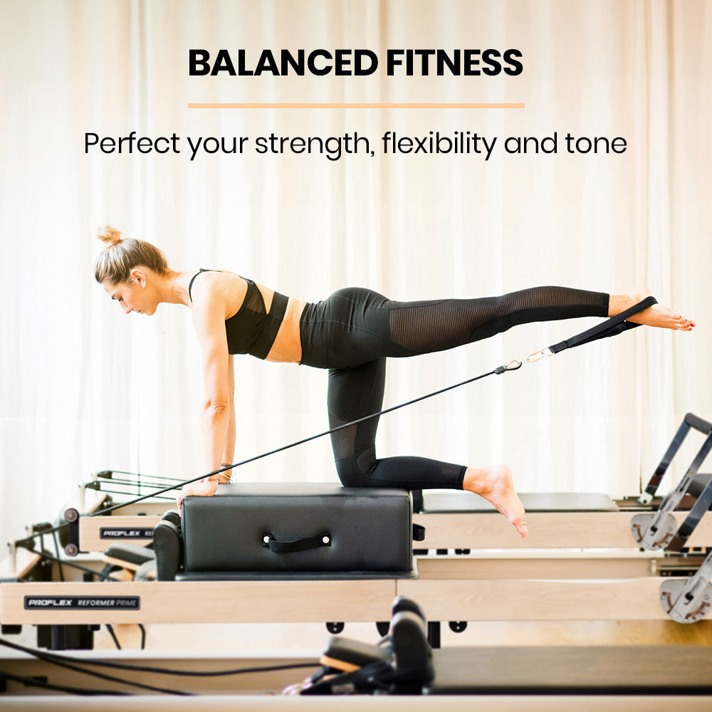 Hlpmedical PROFLEX wooden Pilates Reformer machine with stretch bed, box, and jump board accessories for yoga and fitness exercises.