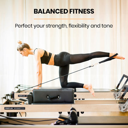 Hlpmedical PROFLEX wooden Pilates Reformer machine with stretch bed, box, and jump board accessories for yoga and fitness exercises.
