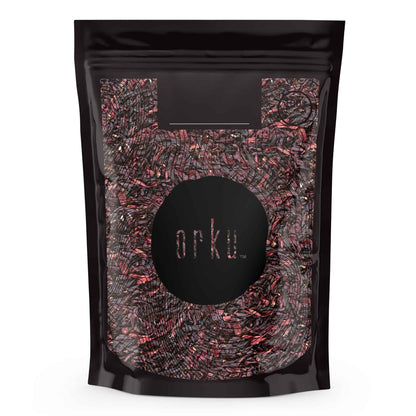 Crushed organic hibiscus rosella flowers in a jar, dried herbal tea supplement for teas and beverages.