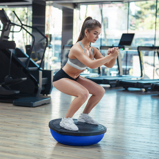 Blue Powertrain Fitness yoga ball used as a balance trainer for home gym workouts, designed for exercise and fitness training.