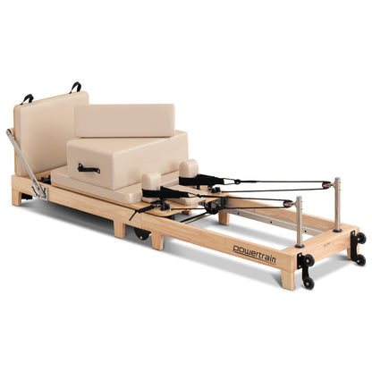 Wooden Powertrain Selina Pilates Reformer Machine with jumpboard and sitting box in oak beige, suitable for home gym workouts.