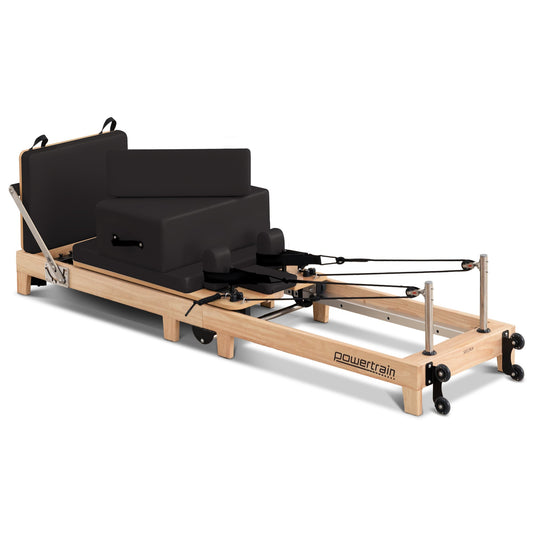 Hlpmedical Powertrain Selina Pilates Reformer Machine in oak and black with wooden frame, jumpboard, and sitting box for home gym fitness