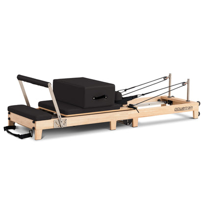 Hlpmedical Powertrain Selina Pilates Reformer Machine in oak and black with jumpboard and sitting box, ideal for home gym workouts