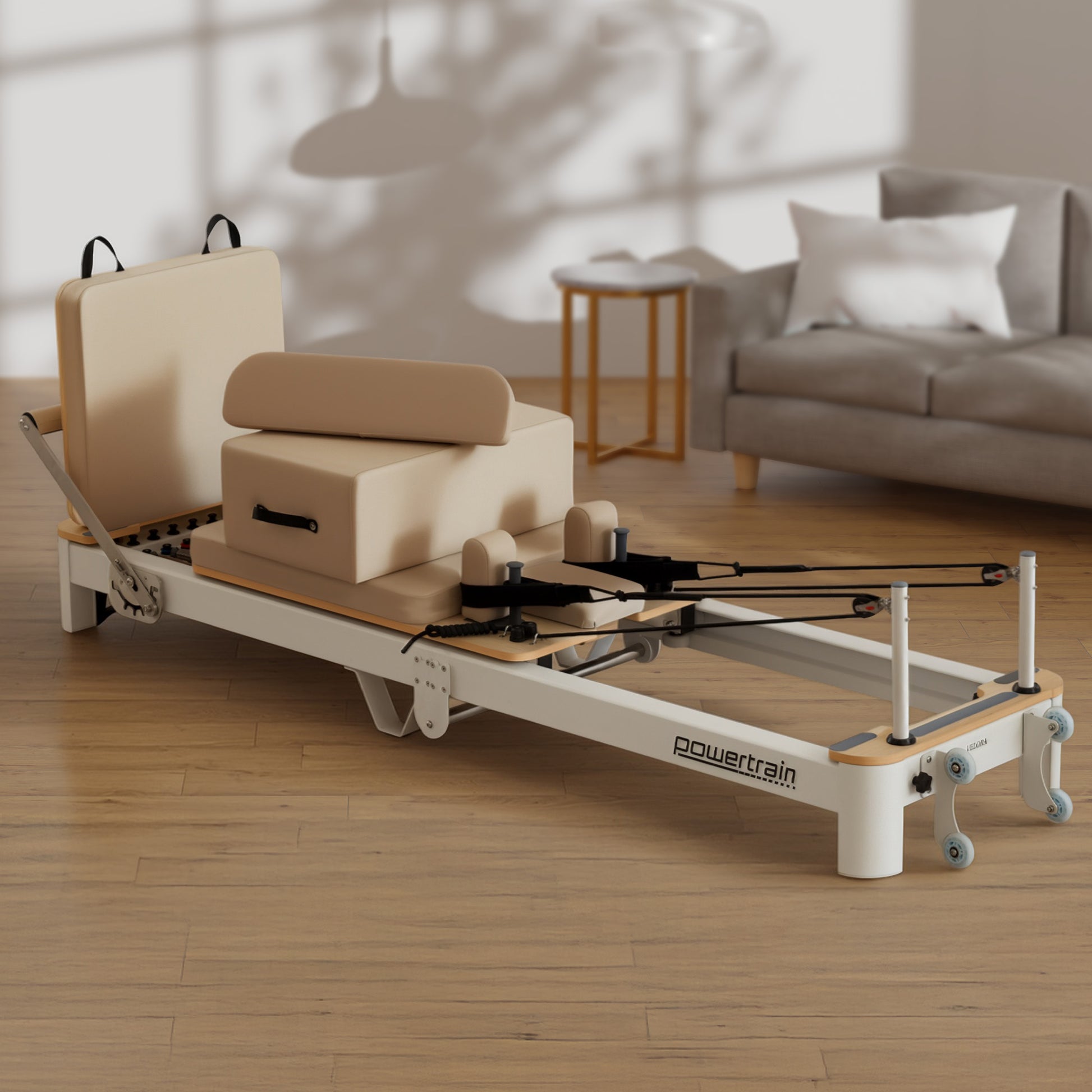 Hlpmedical Powertrain Velora beige aluminium foldable Pilates reformer with core exercise attachments, sitting box, and footbar for full-body workouts