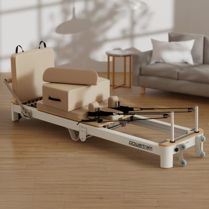 Hlpmedical Powertrain Velora beige aluminium foldable Pilates reformer with core exercise attachments, sitting box, and footbar for full-body workouts