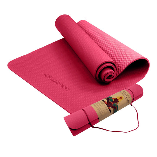 Pink Powertrain dual-layer 6mm yoga mat with non-slip surface and carry strap for comfortable, portable yoga and Pilates practice.