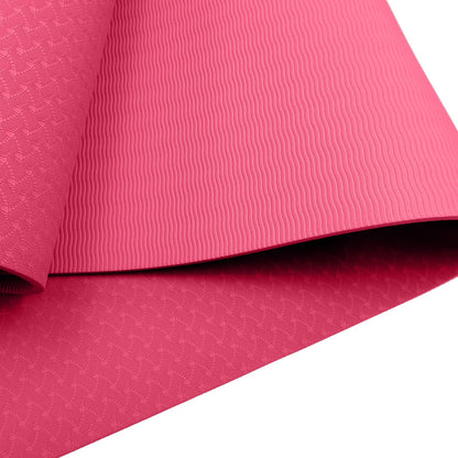 Pink Powertrain dual layer 6mm yoga mat with non-slip surface and carry strap for comfortable yoga practice and portability.