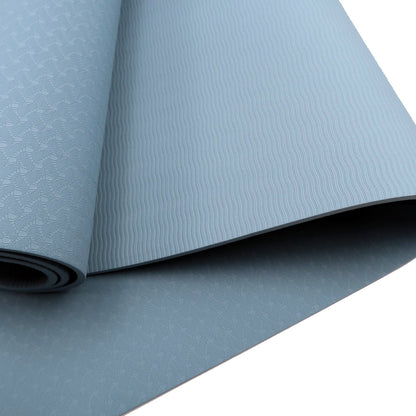Sky blue Powertrain dual-layer 6mm yoga mat with non-slip surface and carry strap for comfort and portability.