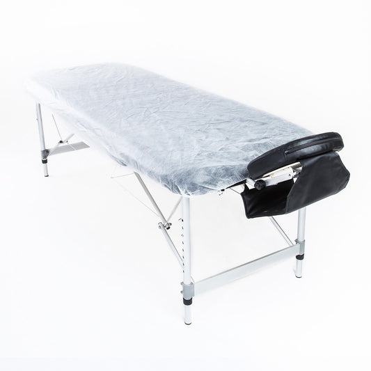 Set of 15 disposable massage table sheet covers in white, 180cm by 55cm, for hygienic use on massage chairs.