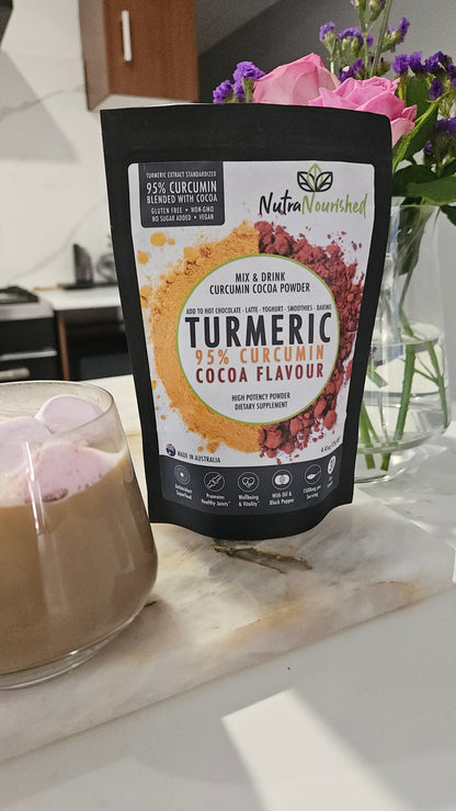 Organic turmeric powder with cocoa flavor and black pepper, 125g, in a resealable package for health and wellness supplements.