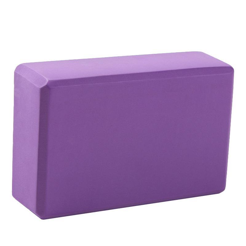 Two purple foam yoga blocks for stretching and Pilates exercises, suitable for gym and fitness routines.