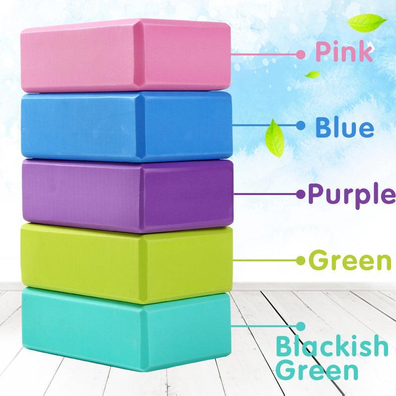 Two green foam yoga blocks for exercise and Pilates, ideal for stretching and fitness routines, by Hlpmedical.