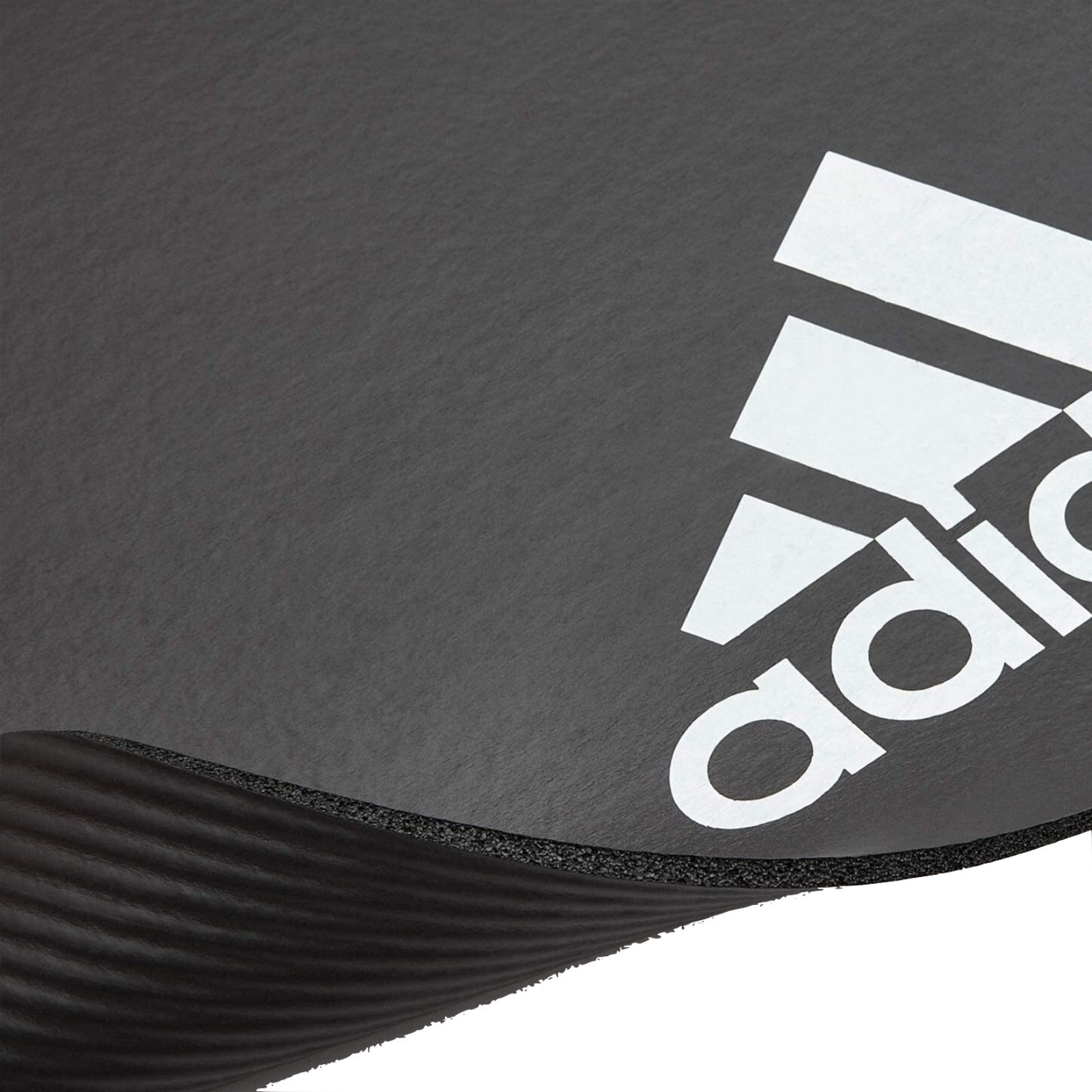 Grey Adidas fitness mat for yoga, Pilates, and exercise, featuring 7mm thickness for comfortable gym and training workouts.