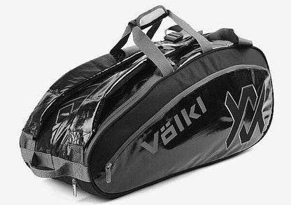 Volkl Primo Combi tennis bag in black and charcoal, designed to hold 6-9 racquets, with multiple compartments for sports gear