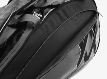 Volkl Primo Combi tennis bag in black and charcoal, designed to carry 6-9 racquets, with multiple compartments.