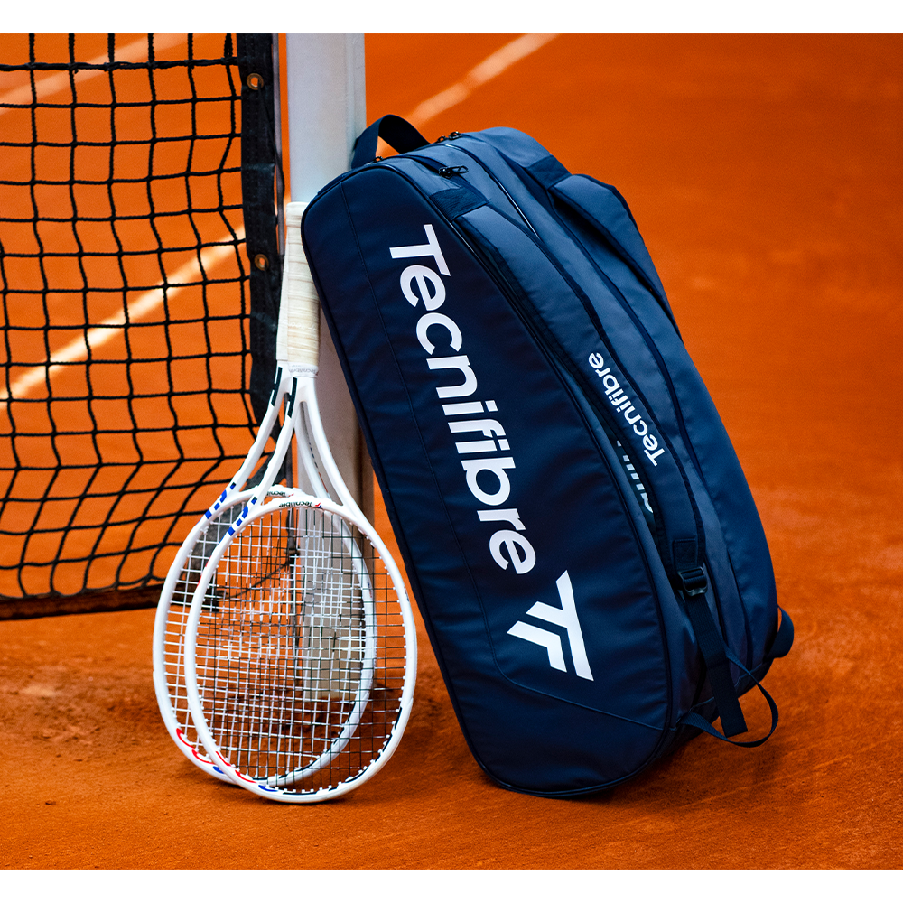 Navy blue Tecnifibre Tour Endurance 9 tennis and squash racquet bag with multiple compartments for sports gear.