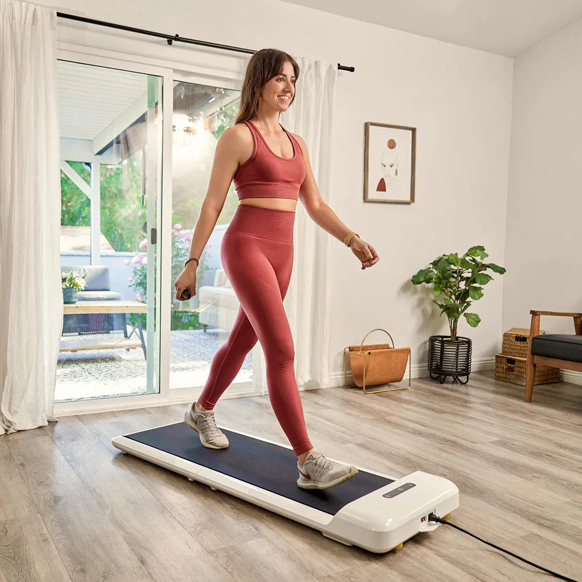 White Hlpmedical WalkingPad C2 compact folding treadmill for exercise and fitness, shown in a folded position