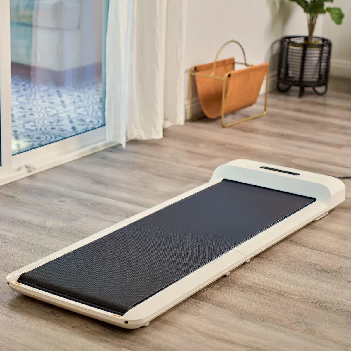 Hlpmedical WalkingPad C2 compact folding treadmill in white, displayed folded with control panel and running surface visible.