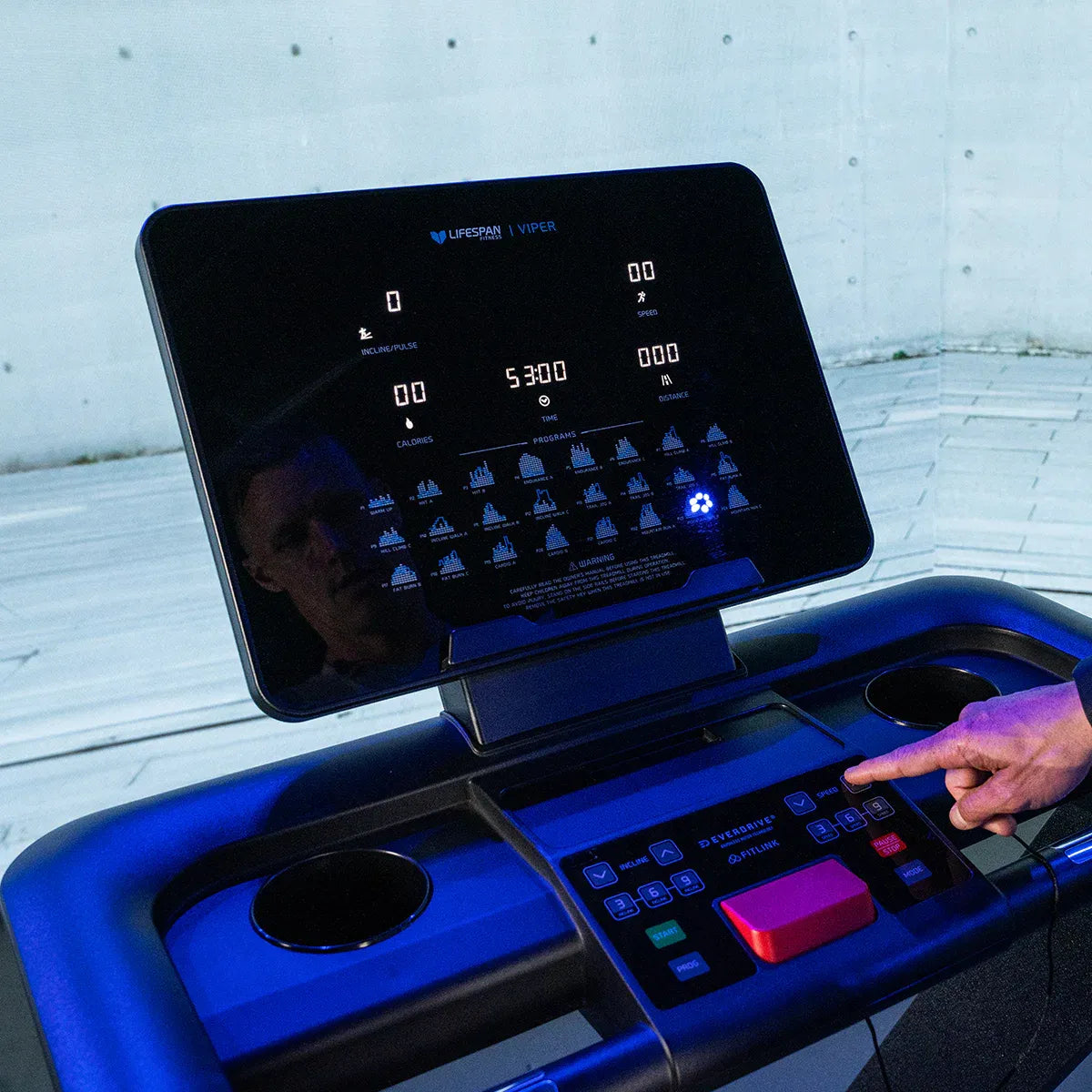 Lifespan Fitness Viper M4 treadmill from Hlpmedical, showing the sleek running deck and control panel in a gym setting.