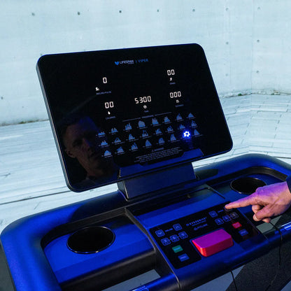 Lifespan Fitness Viper M4 treadmill from Hlpmedical, showing the sleek running deck and control panel in a gym setting.
