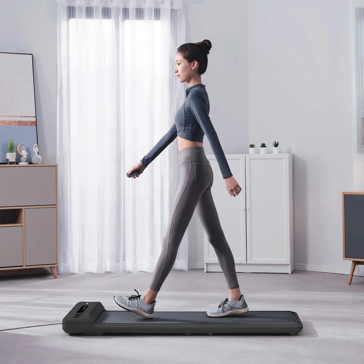 Hlpmedical Lifespan Fitness WalkingPad M2 treadmill with black running belt and control panel for indoor walking exercise.