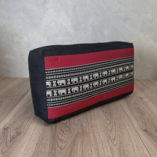 RedEle brand oblong meditation cushion filled with kapok, used for yoga and wellness practices, in vibrant red color.