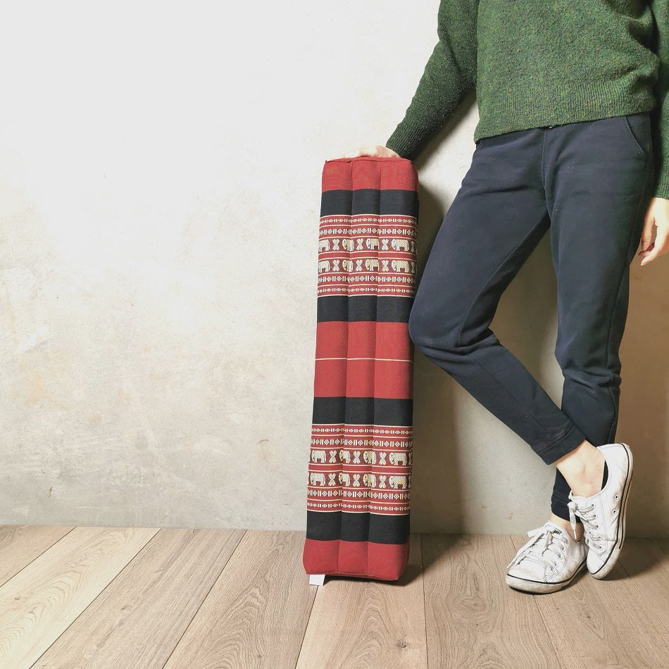 Red bolster yoga block filled with natural kapok, 80cm long, suitable for yoga and fitness exercises, by Hlpmedical.