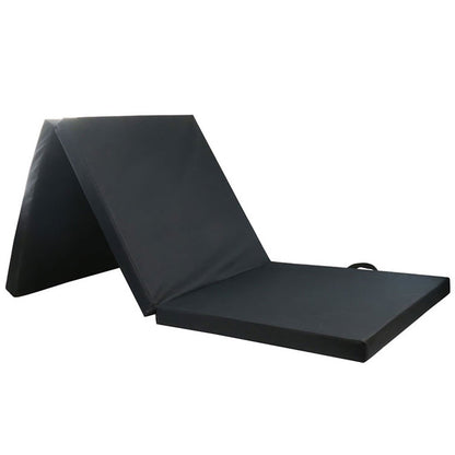 Black folding exercise floor mat for dance, yoga, gymnastics, and Pilates, ideal for home gym and gymnastics training.
