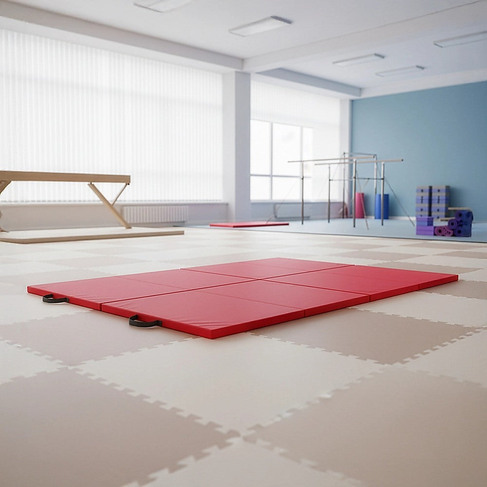 Red folding exercise mat by Hlpmedical for gymnastics, martial arts, yoga, karate, and judo training, shown folded and unfolded.