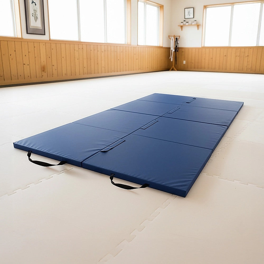 Blue folding exercise mat by Hlpmedical for gymnastics, yoga, martial arts, and fitness training, displayed folded and open.