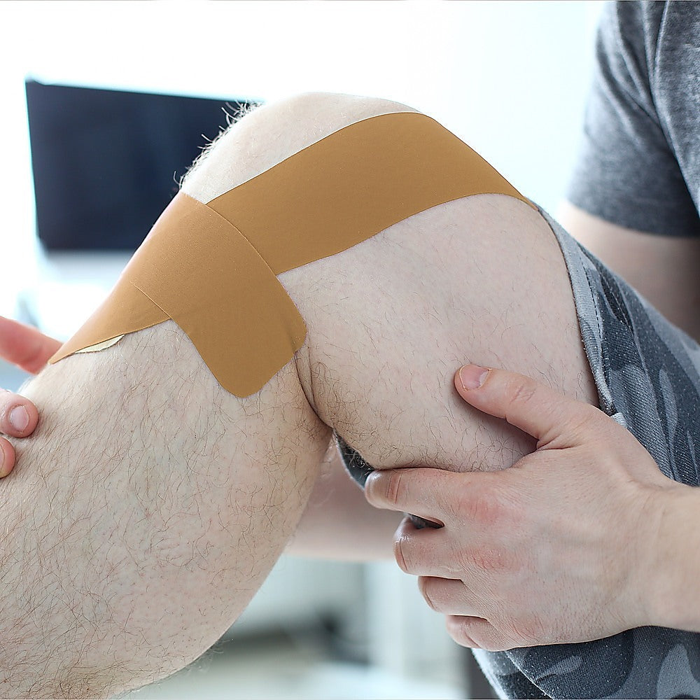 Box of 30 rolls of Hlpmedical premium rigid sports strapping tape in 38mm x 13.7m for sports injury support and bracing.