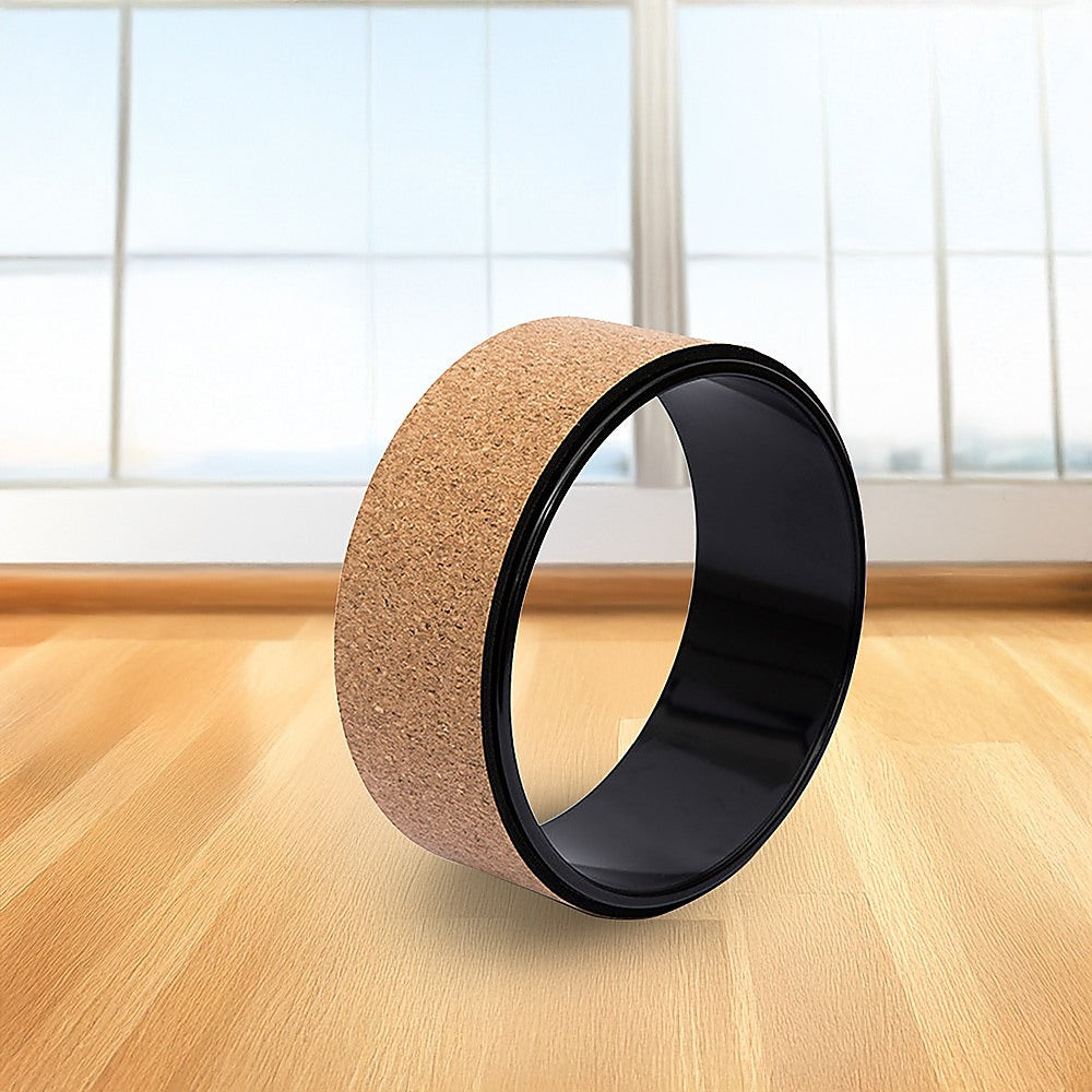 Hlpmedical yoga Pilates wheel made of cork, used for back, chest, hips, and abdomen stretching and fitness exercises.
