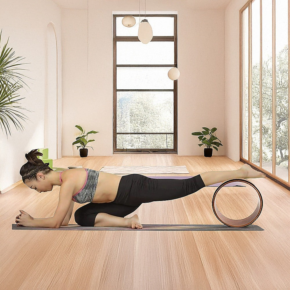 Hlpmedical yoga Pilates wheel cork circle prop for back chest hips and abdomen stretching, used in yoga and fitness routines.