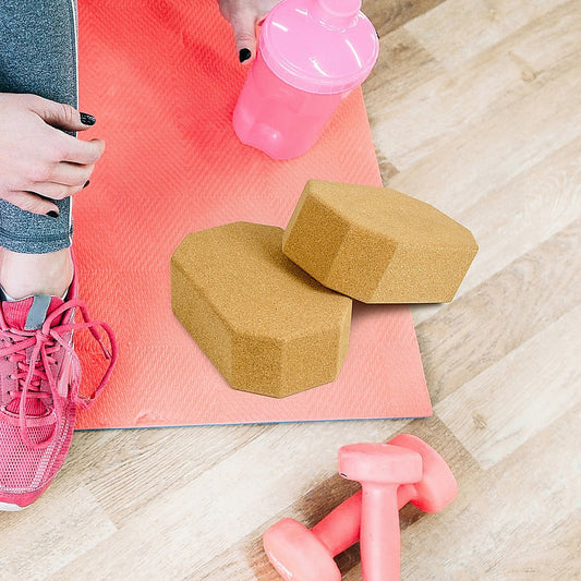 Set of two natural cork octagon yoga blocks from Hlpmedical, eco-friendly, non-slip exercise bricks for yoga and Pilates practice.