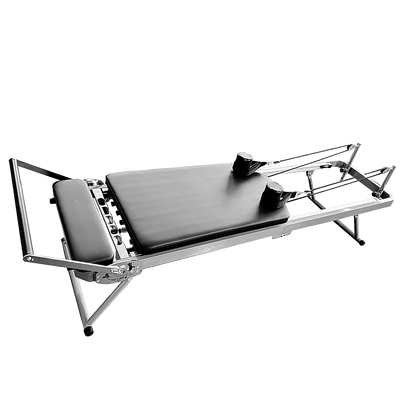 Foldable Hlpmedical Pilates Reformer Machine with adjustable straps and cushioned platform for full-body Pilates workouts.