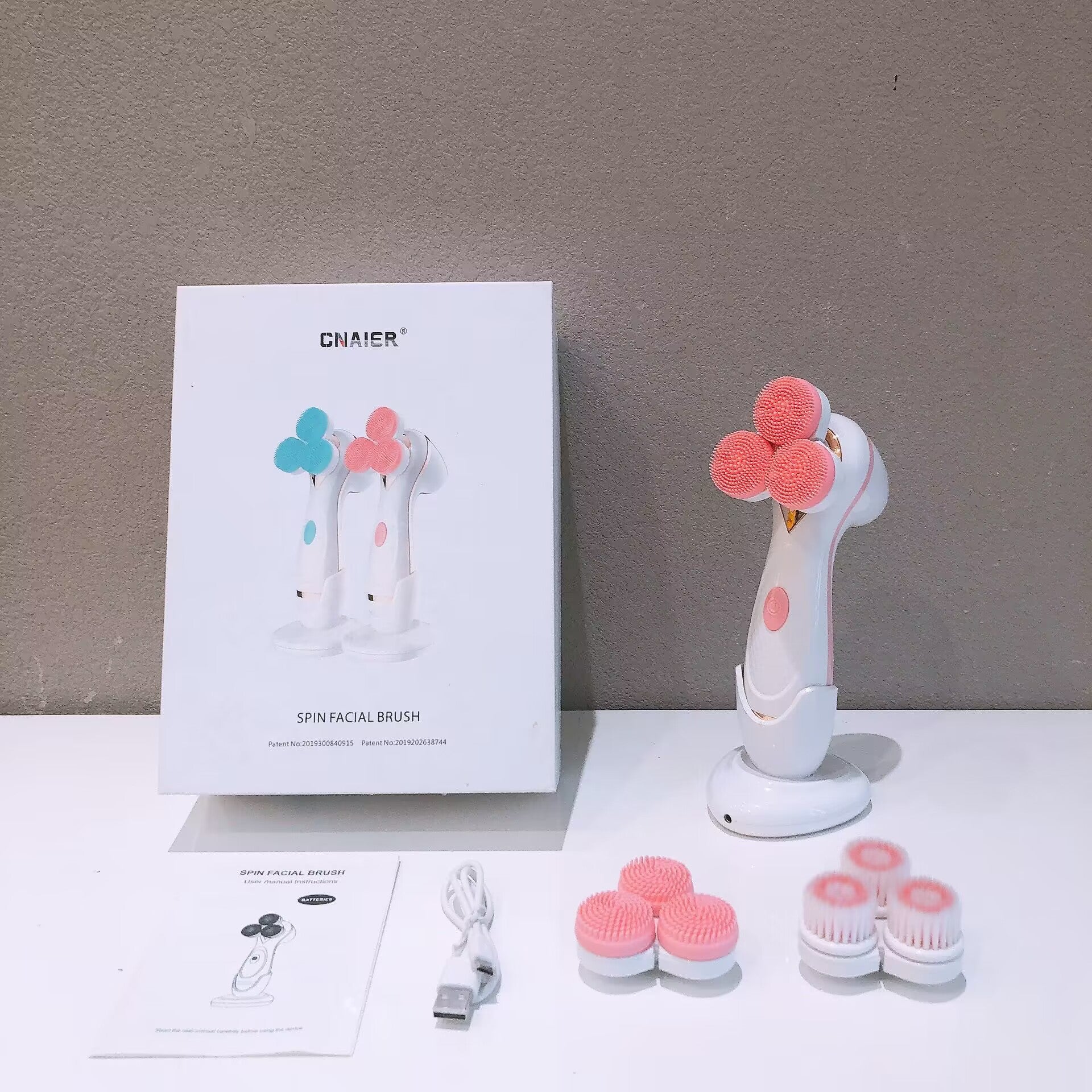 Pink Hlpmedical 3-head electric facial cleansing brush for babies, rechargeable spin scrubber kit for gentle skincare and grooming.