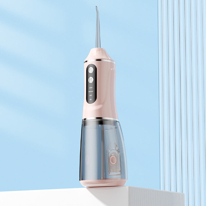 Portable electric oral irrigator by Hlpmedical with pink body, 4 nozzles, and 3 pressure modes for effective oral hygiene.