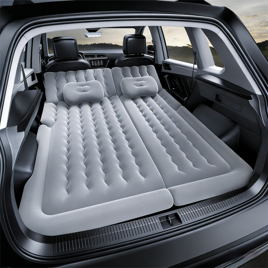 Grey multi-chamber car inflatable air mattress with electric pump, pillows, and storage bag for trunk sleeping and camping.
