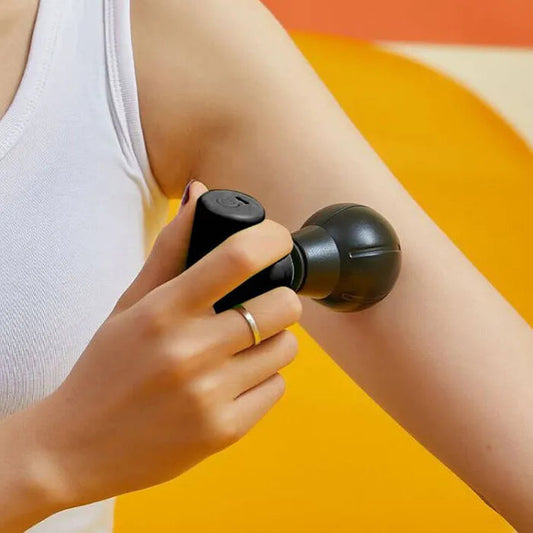 Hlpmedical Remology Mini Massage Gun in black, handheld device for muscle relief and relaxation, compact health and beauty massager