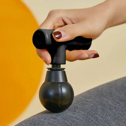 Hlpmedical Remology Mini Massage Gun in black, compact handheld device for muscle relaxation and pain relief.