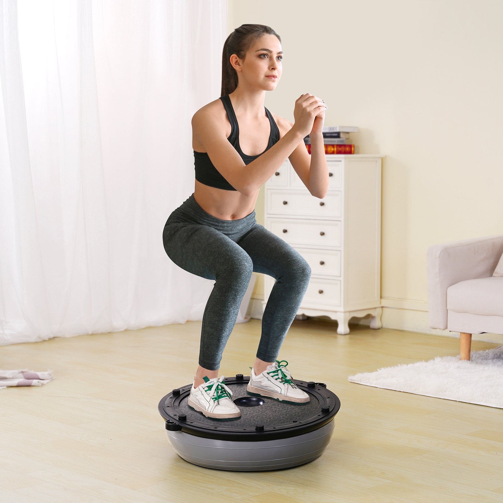 Gray 23-inch Hlpmedical stability ball with resistance bands and foot pump, used for full-body workouts and balance training.