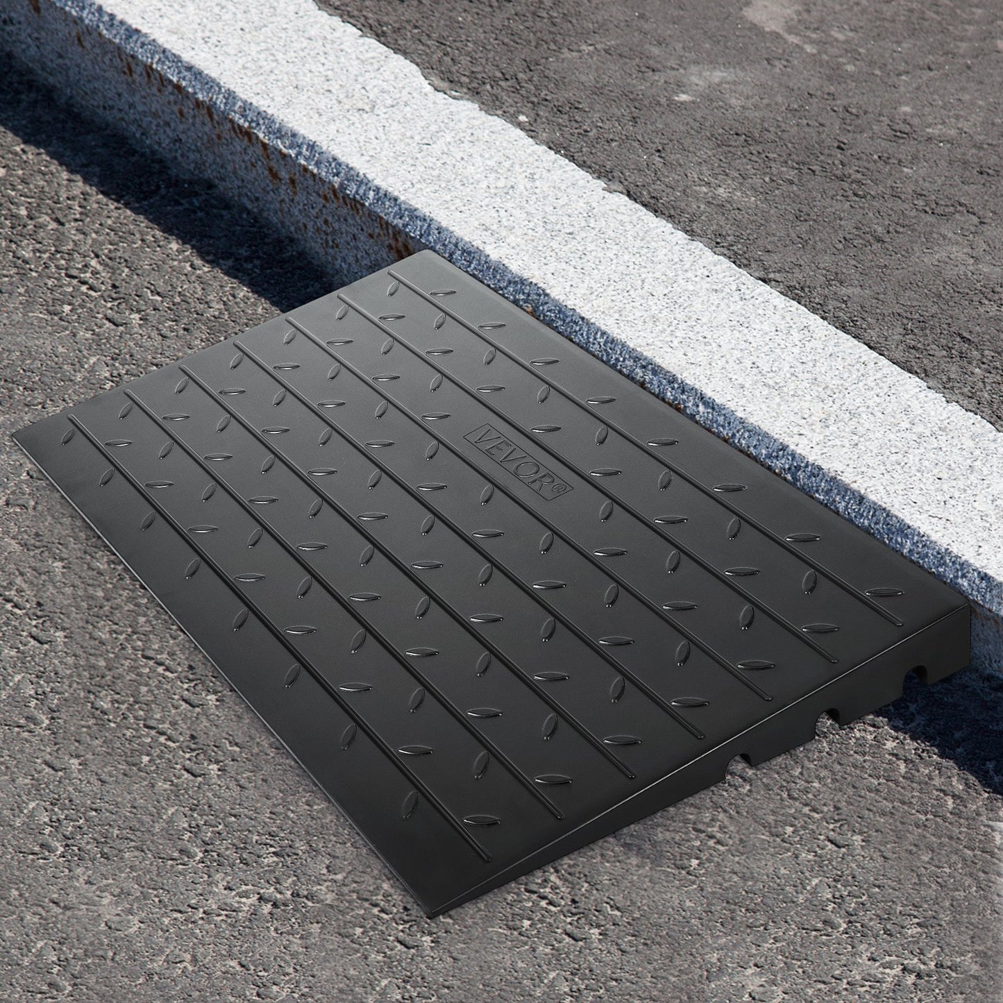 Rubber threshold ramp with 7.62 cm rise and three channels, ideal for wheelchair and scooter entry, rated for 997.9 kg load.